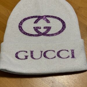 White Knit Hat with Sparkling Purple Emblem